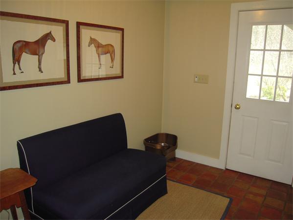 294 Pope Road Acton, MA 01720 - Photo 7 of 30 a blue chair sitting in a small room next to a window