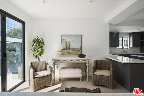 a kitchen with stainless steel appliances a sink and a refrigerator