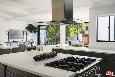 a bedroom with a bed and a lamp with window