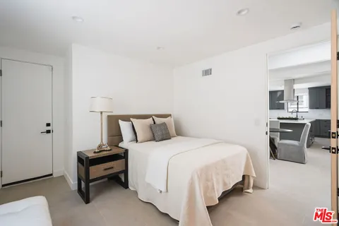 a bathroom with a sink vanity and shower