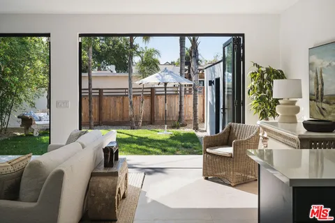 a living room with a couch and a garden