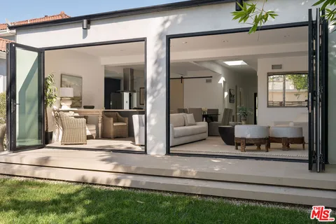 a view of a backyard with a small cabin