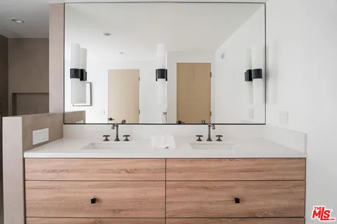 a bathroom with a shower and a sink