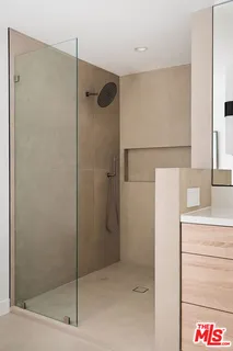 a bathroom with a bathtub and a window