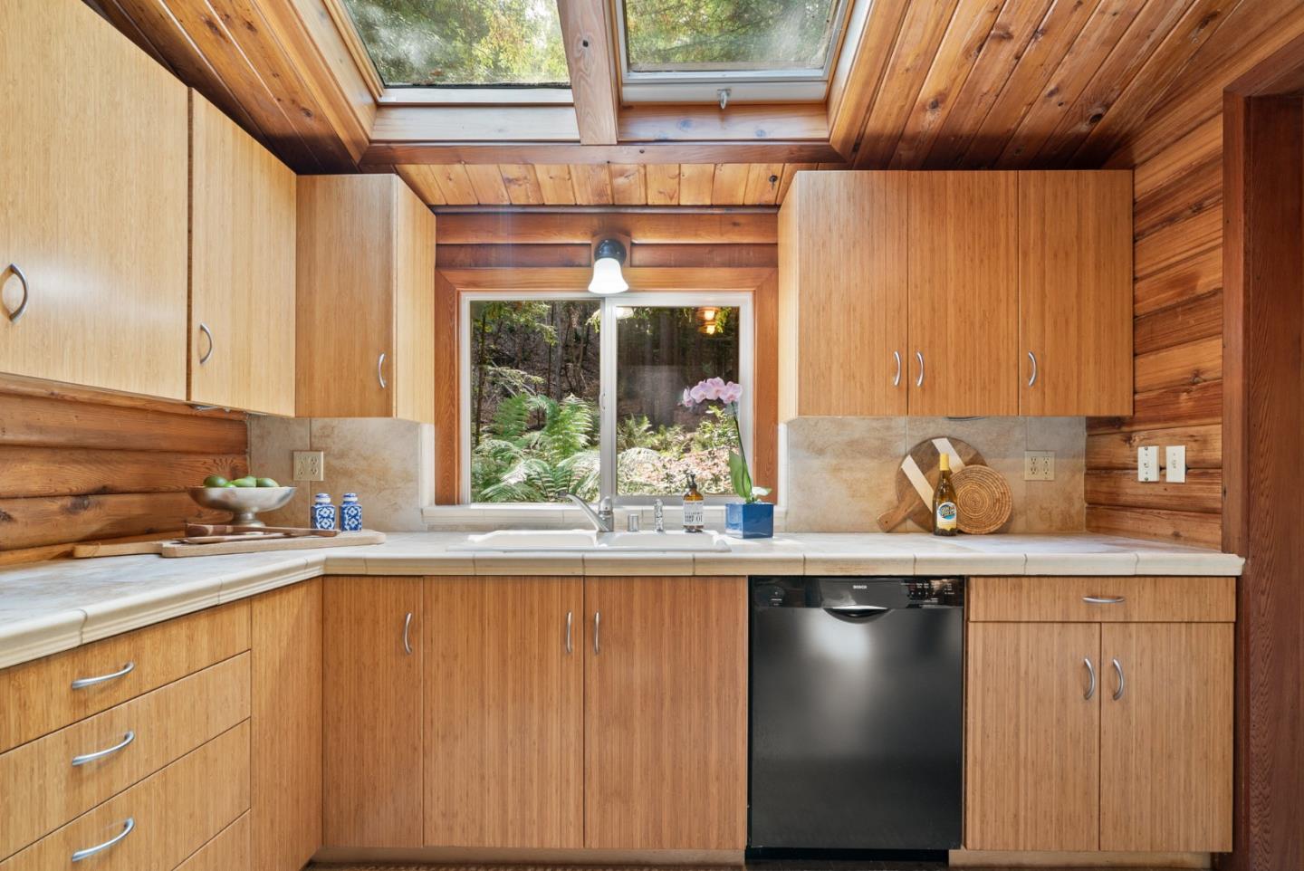 605 Waldeberg Road Ben Lomond, CA 95005 - Photo 12 of 45 a kitchen with a sink and a window