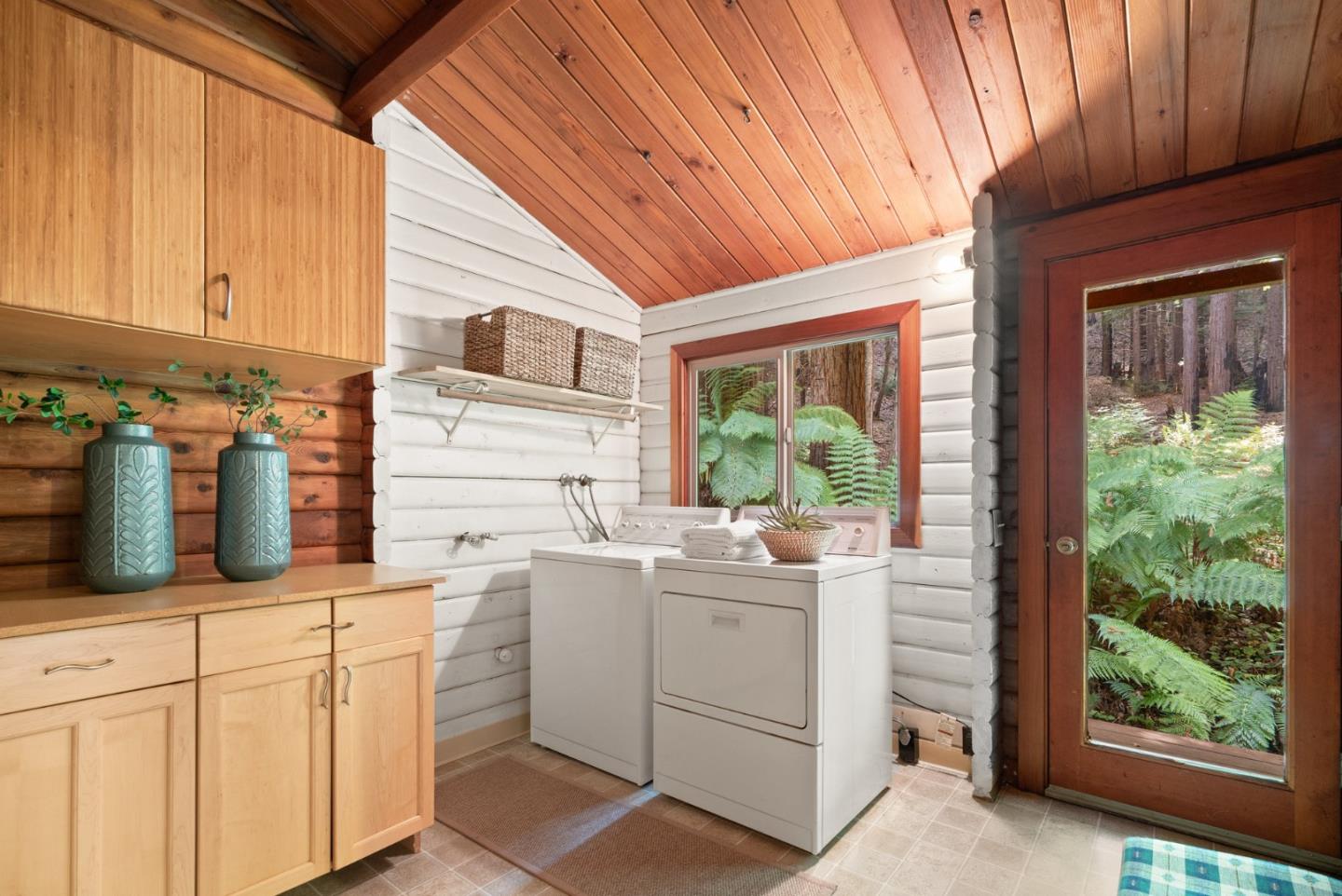 605 Waldeberg Road Ben Lomond, CA 95005 - Photo 14 of 45 a kitchen with white cabinets and window