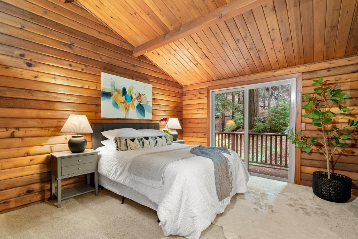 605 Waldeberg Road Ben Lomond, CA 95005 - Photo 18 of 45 a bedroom with a bed lamp and a large window