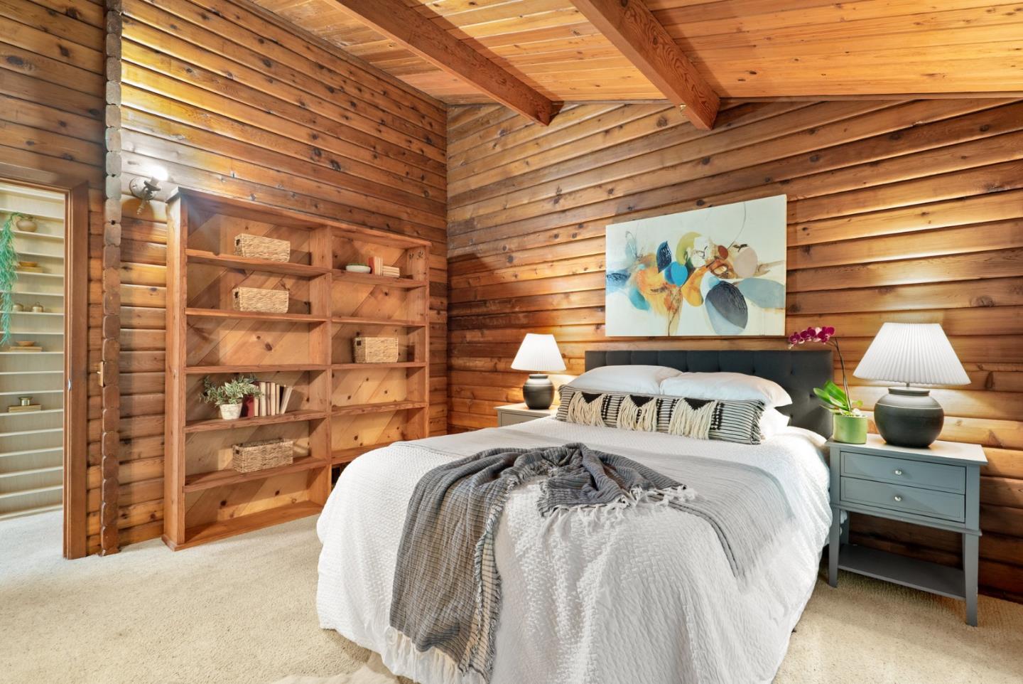 605 Waldeberg Road Ben Lomond, CA 95005 - Photo 19 of 45 a bed sitting in a bedroom next to a lamp