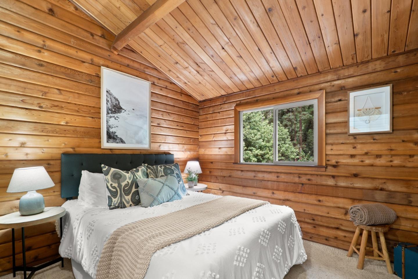 605 Waldeberg Road Ben Lomond, CA 95005 - Photo 22 of 45 a bedroom with bed and window