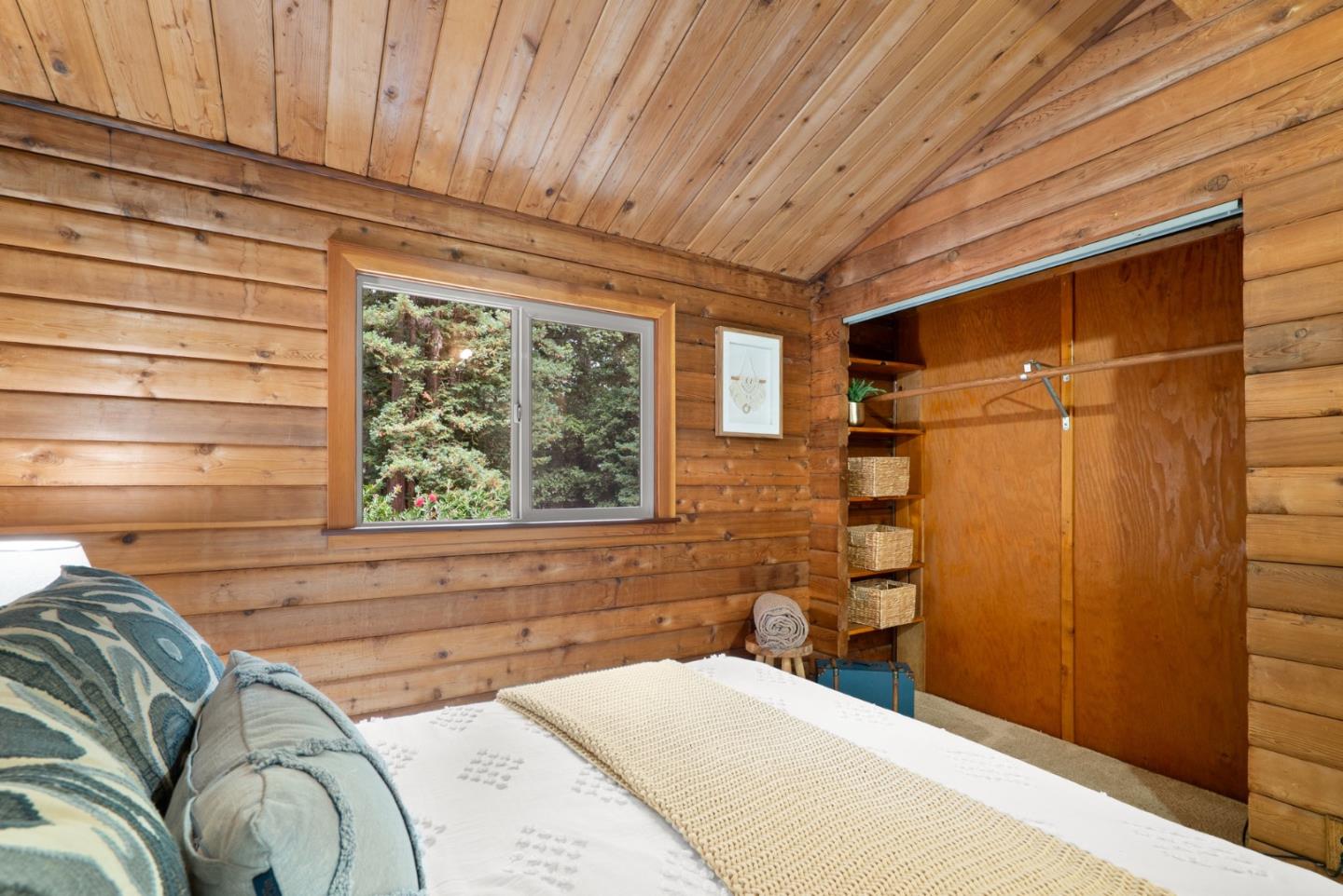 605 Waldeberg Road Ben Lomond, CA 95005 - Photo 23 of 45 a bedroom with a bed and a window