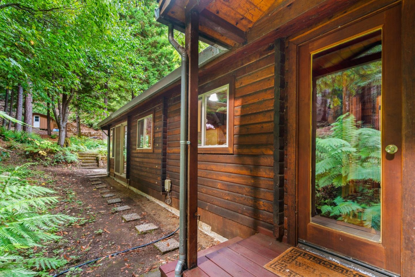 605 Waldeberg Road Ben Lomond, CA 95005 - Photo 28 of 45 a view of a backyard with plants and large tree