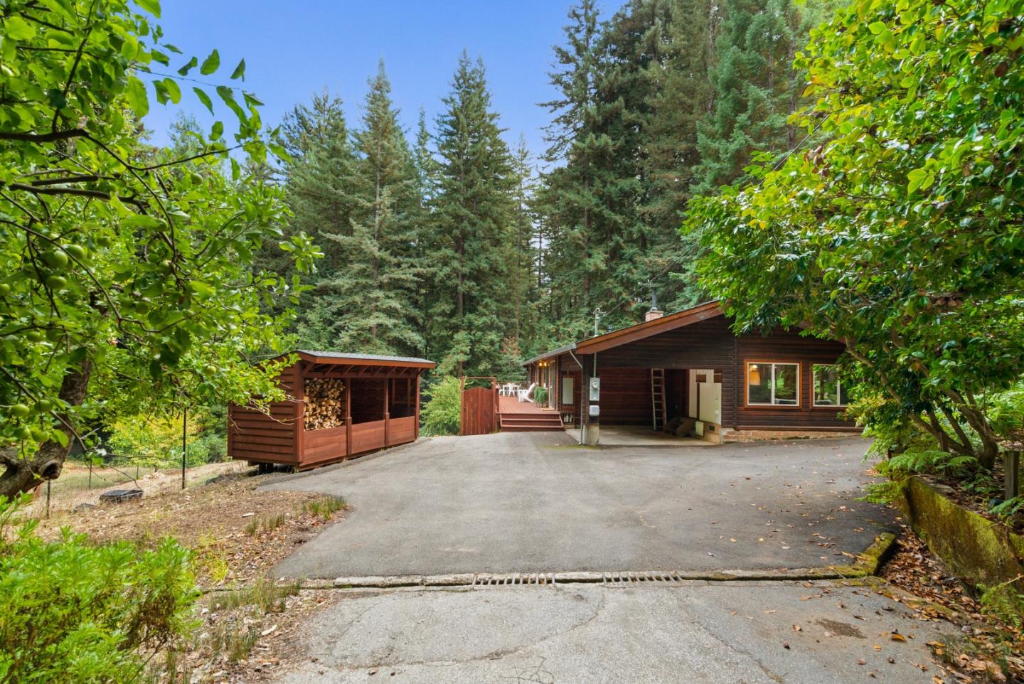 605 Waldeberg Road Ben Lomond, CA 95005 - Photo 35 of 45 a front view of a house with a yard and potted plants