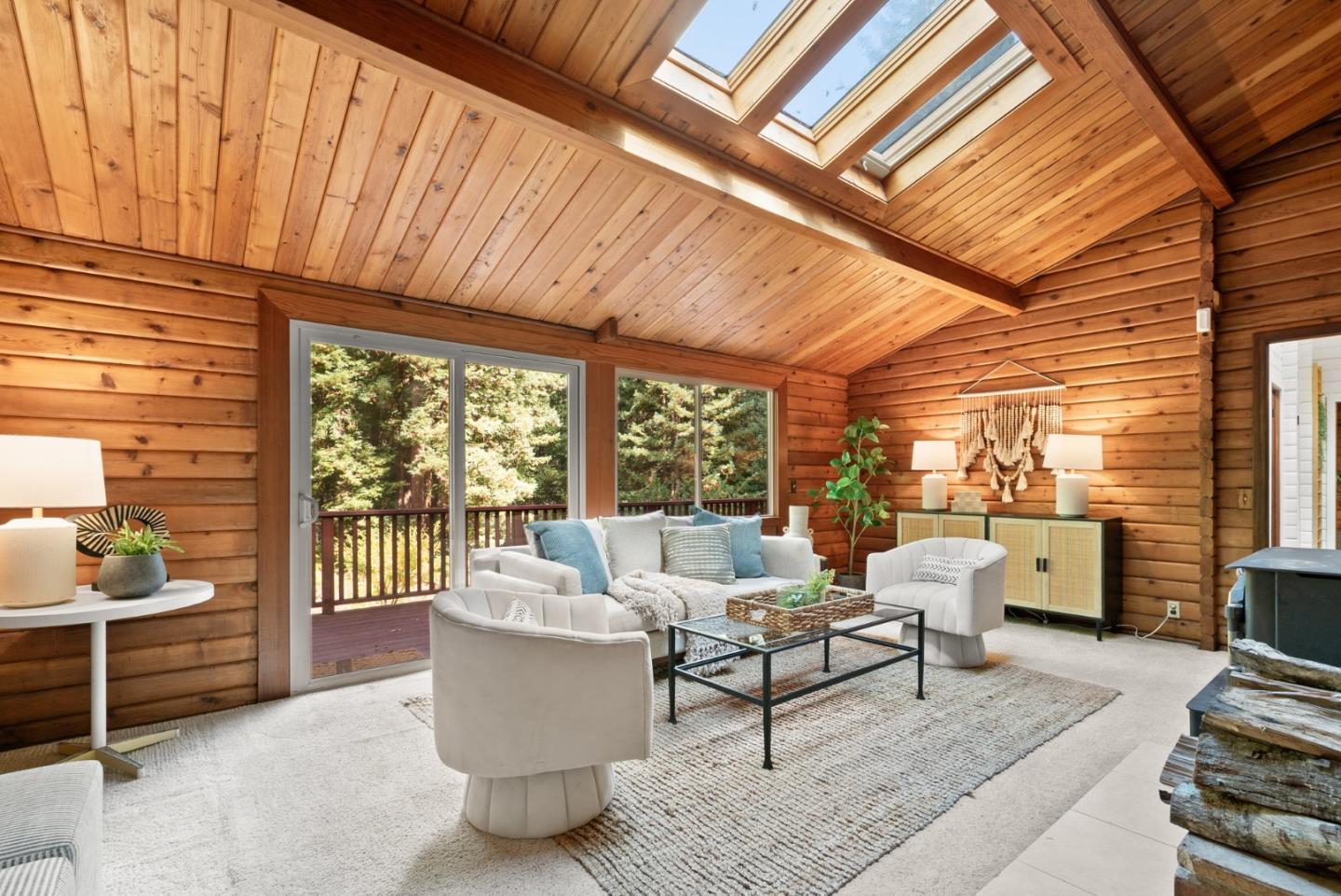 605 Waldeberg Road Ben Lomond, CA 95005 - Photo 4 of 45 a living room with furniture and a floor to ceiling window