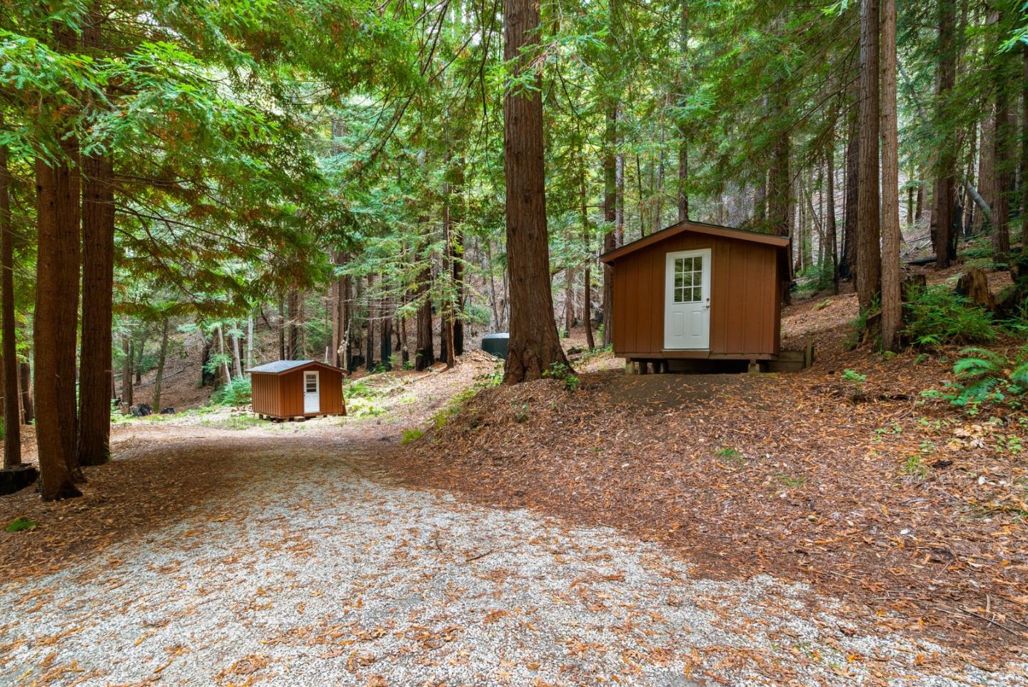 605 Waldeberg Road Ben Lomond, CA 95005 - Photo 41 of 45 a view of a house with large trees and fence