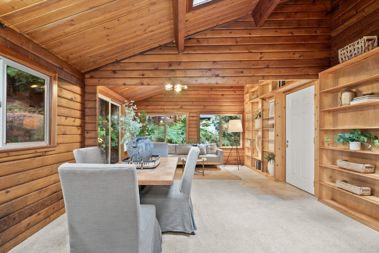 605 Waldeberg Road Ben Lomond, CA 95005 - Photo 9 of 45 a dining room with furniture and a floor to ceiling window