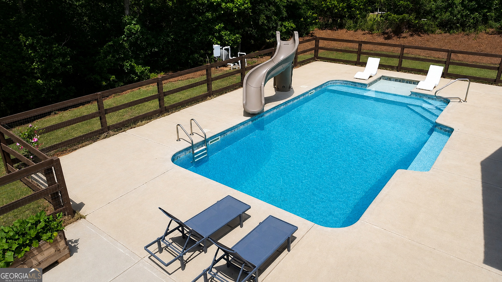 89 Claire Road Forsyth, GA 31029 - Photo 36 of 40 a view of swimming pool with seating area