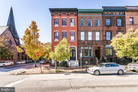 a view of street with parked cars
