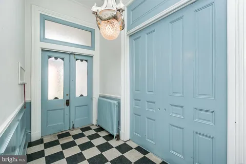 a view of a bathroom with a sink and a mirror