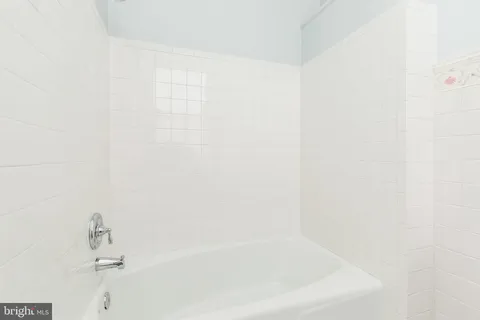 a bathroom with a toilet a sink and a window