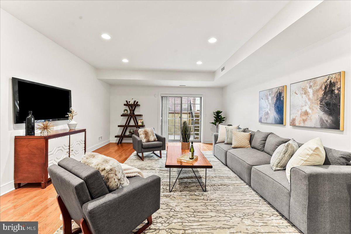 677 North 15th Street Philadelphia, PA 19130 - Photo 22 of 52 a living room with furniture and a flat screen tv