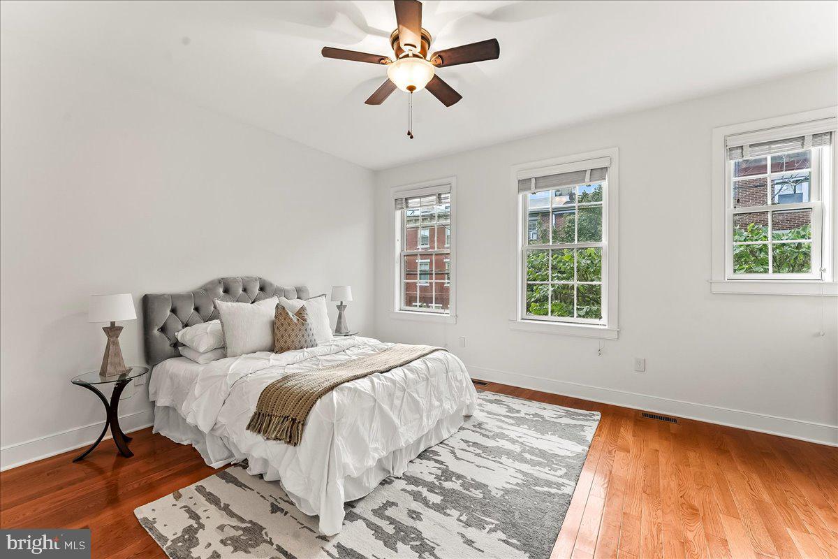 677 North 15th Street Philadelphia, PA 19130 - Photo 28 of 52 a bedroom with a bed and a window