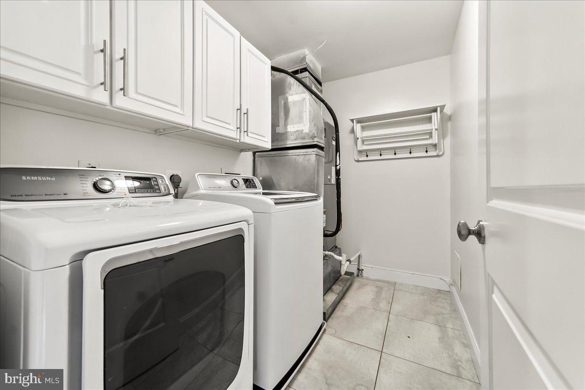 677 North 15th Street Philadelphia, PA 19130 - Photo 30 of 52 a utility room with dryer and washer
