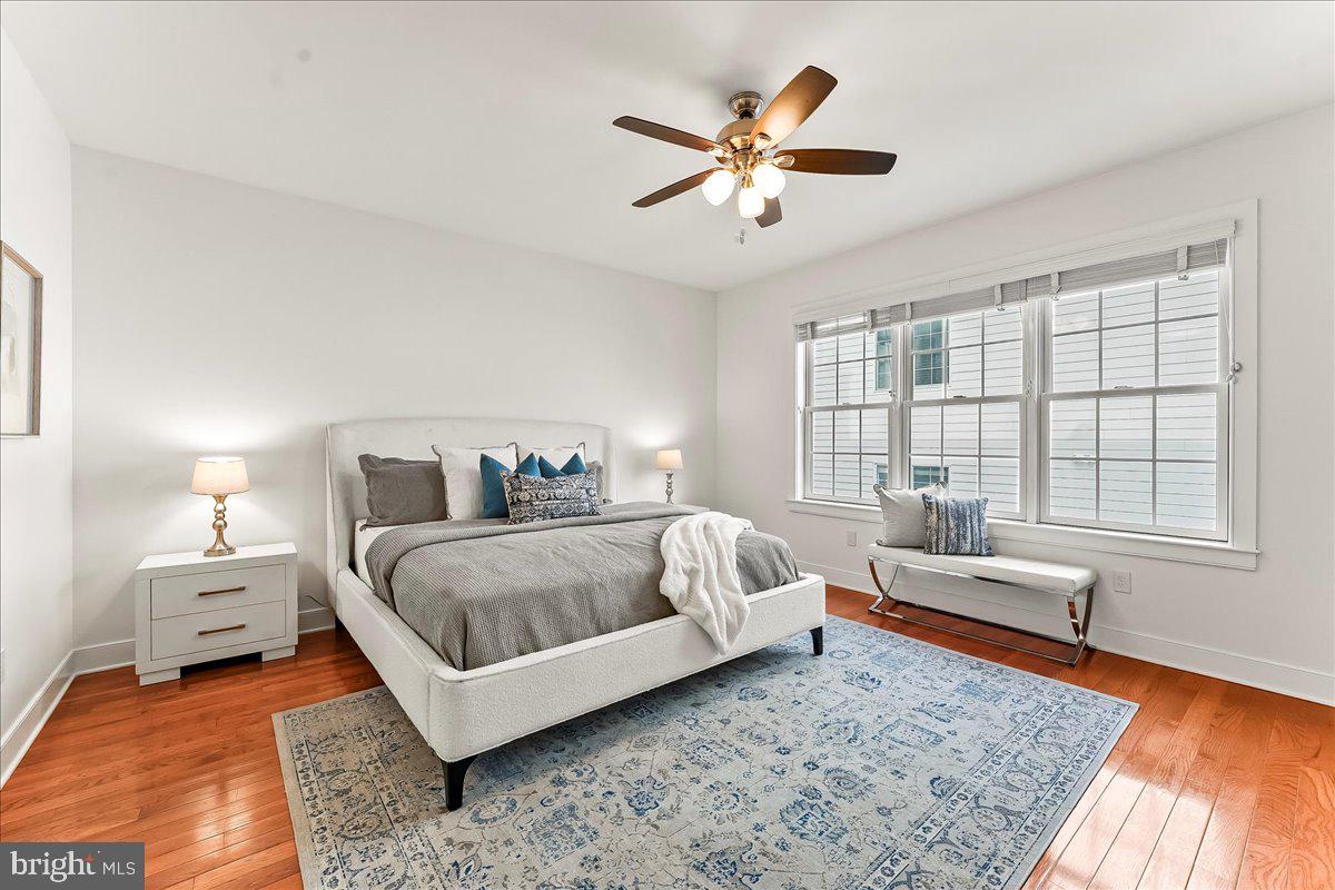 677 North 15th Street Philadelphia, PA 19130 - Photo 32 of 52 a spacious bedroom with a bed a couch and a window
