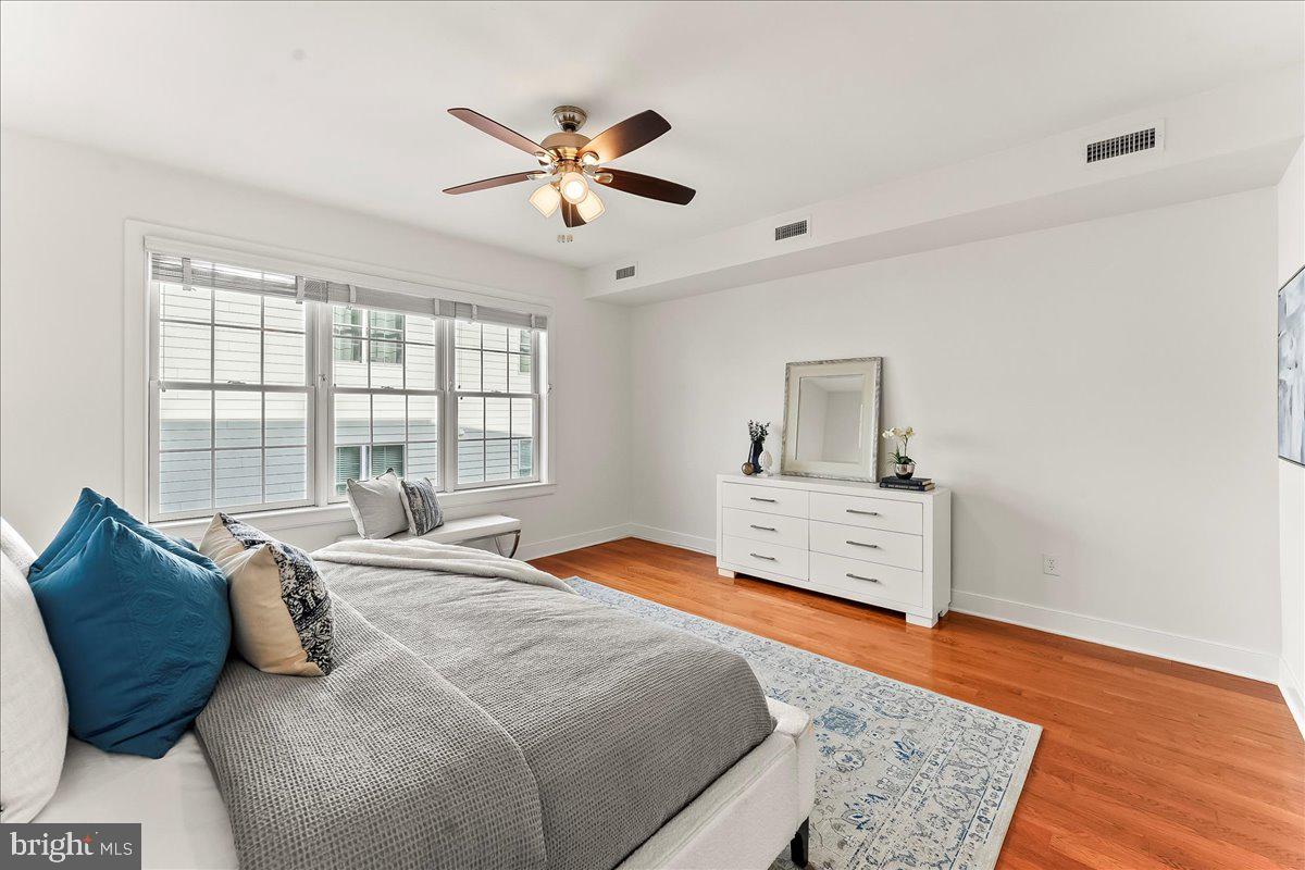 677 North 15th Street Philadelphia, PA 19130 - Photo 33 of 52 a bedroom with a bed and wooden floor