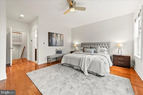 a bed room with a bed dresser and a window