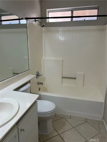 a bathroom with a toilet a sink and bathtub