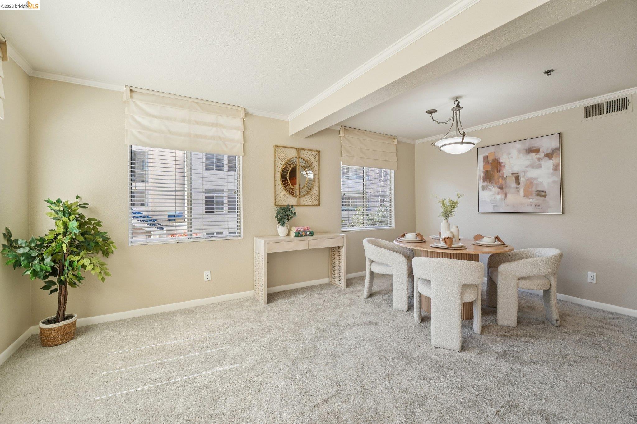 535 Pierce Street, Unit 3216 Albany, CA 94706 - Photo 12 of 47 Dining room with crown molding and light carpet