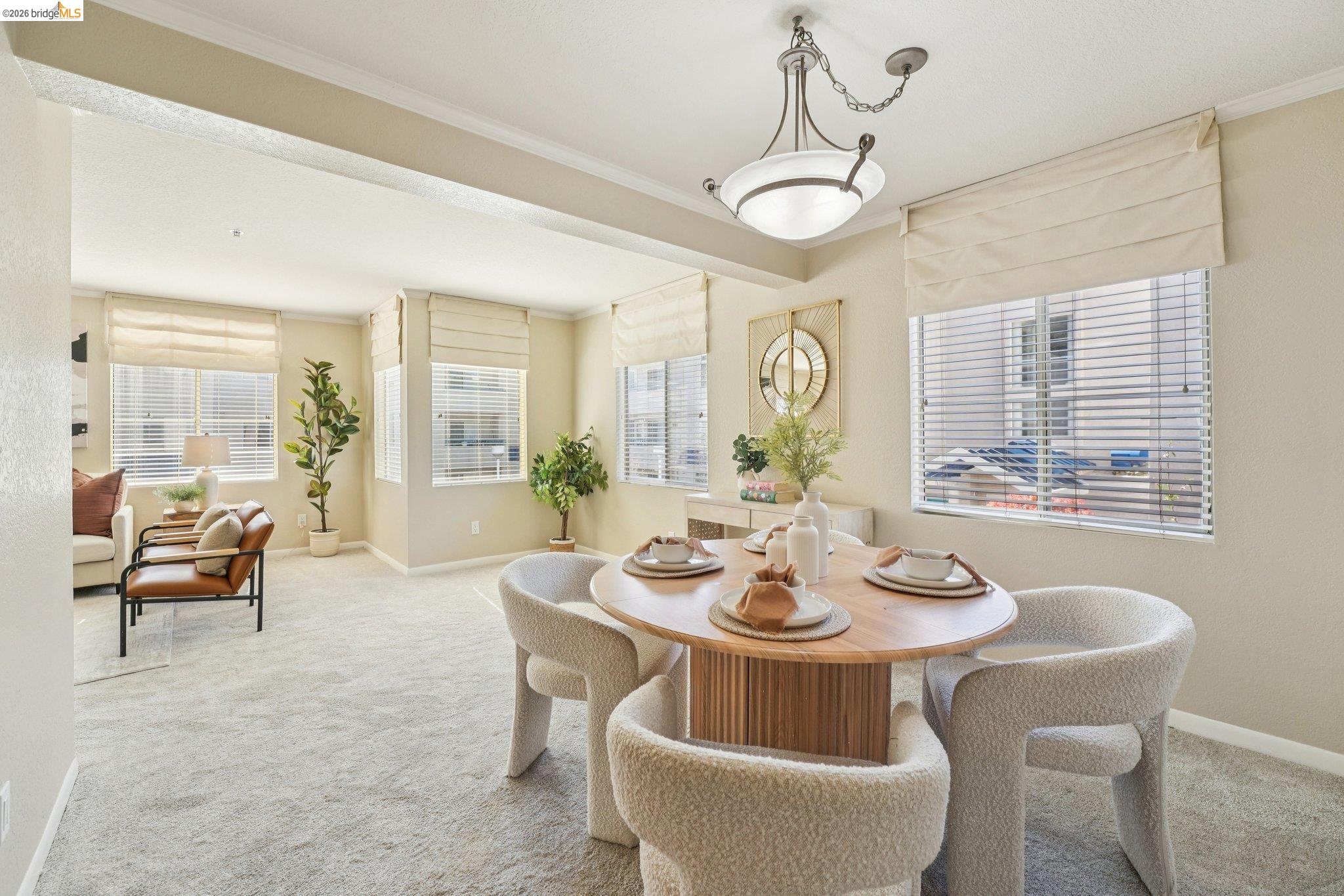 535 Pierce Street, Unit 3216 Albany, CA 94706 - Photo 13 of 47 Dining space featuring crown molding and light colored carpet