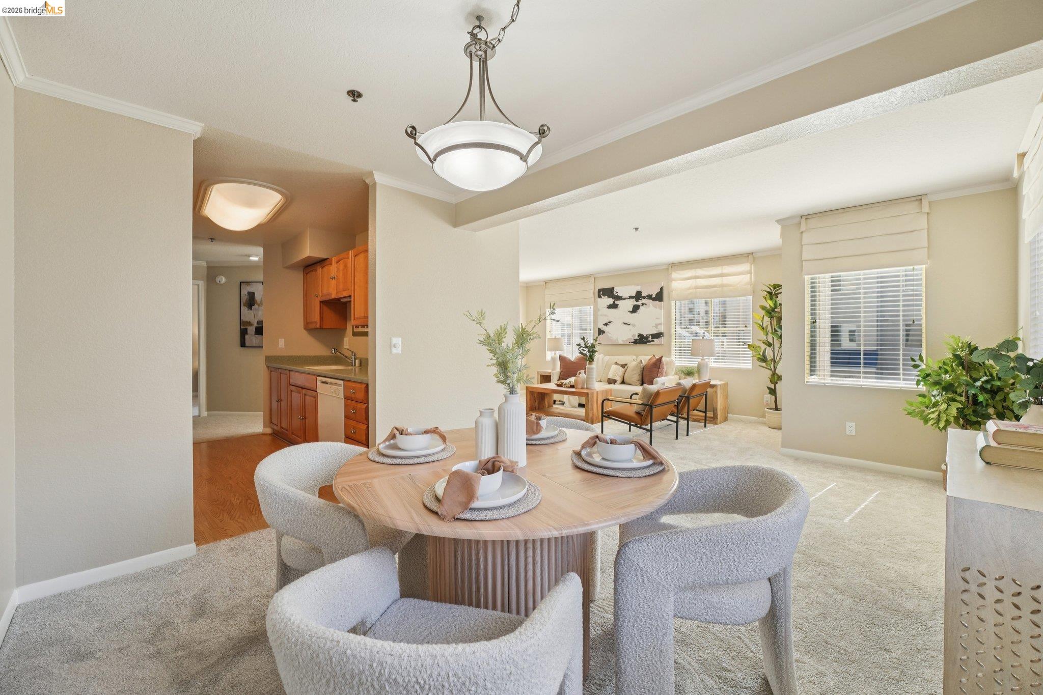 535 Pierce Street, Unit 3216 Albany, CA 94706 - Photo 14 of 47 Dining space featuring crown molding and light colored carpet