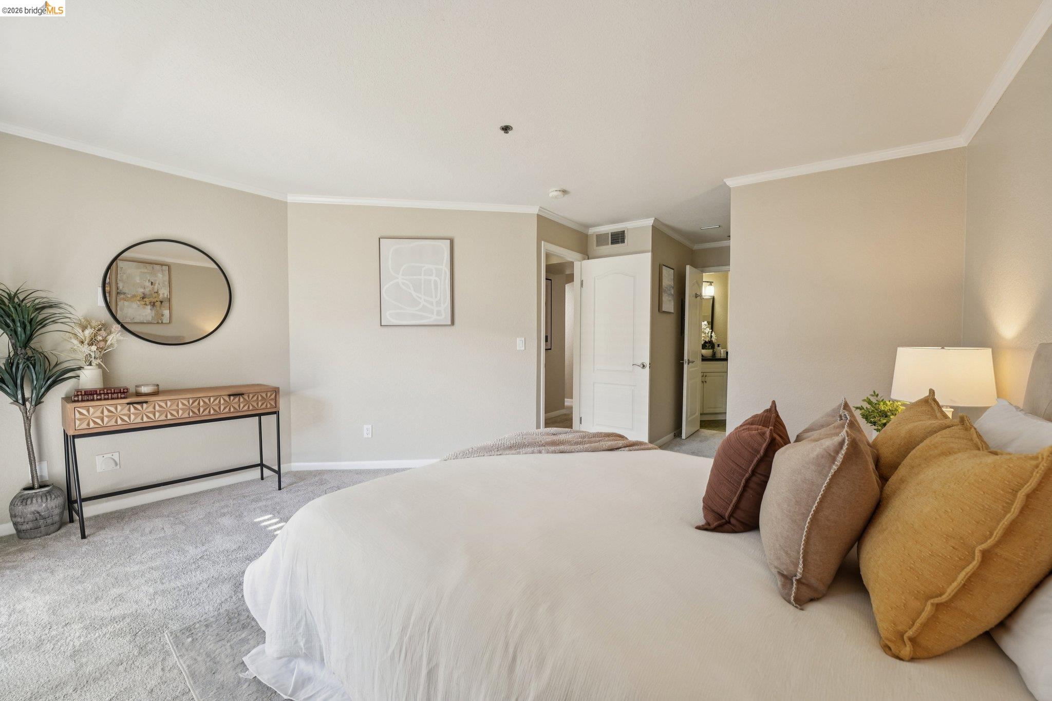 535 Pierce Street, Unit 3216 Albany, CA 94706 - Photo 32 of 47 Bedroom with light carpet, ornamental molding, and ensuite bath