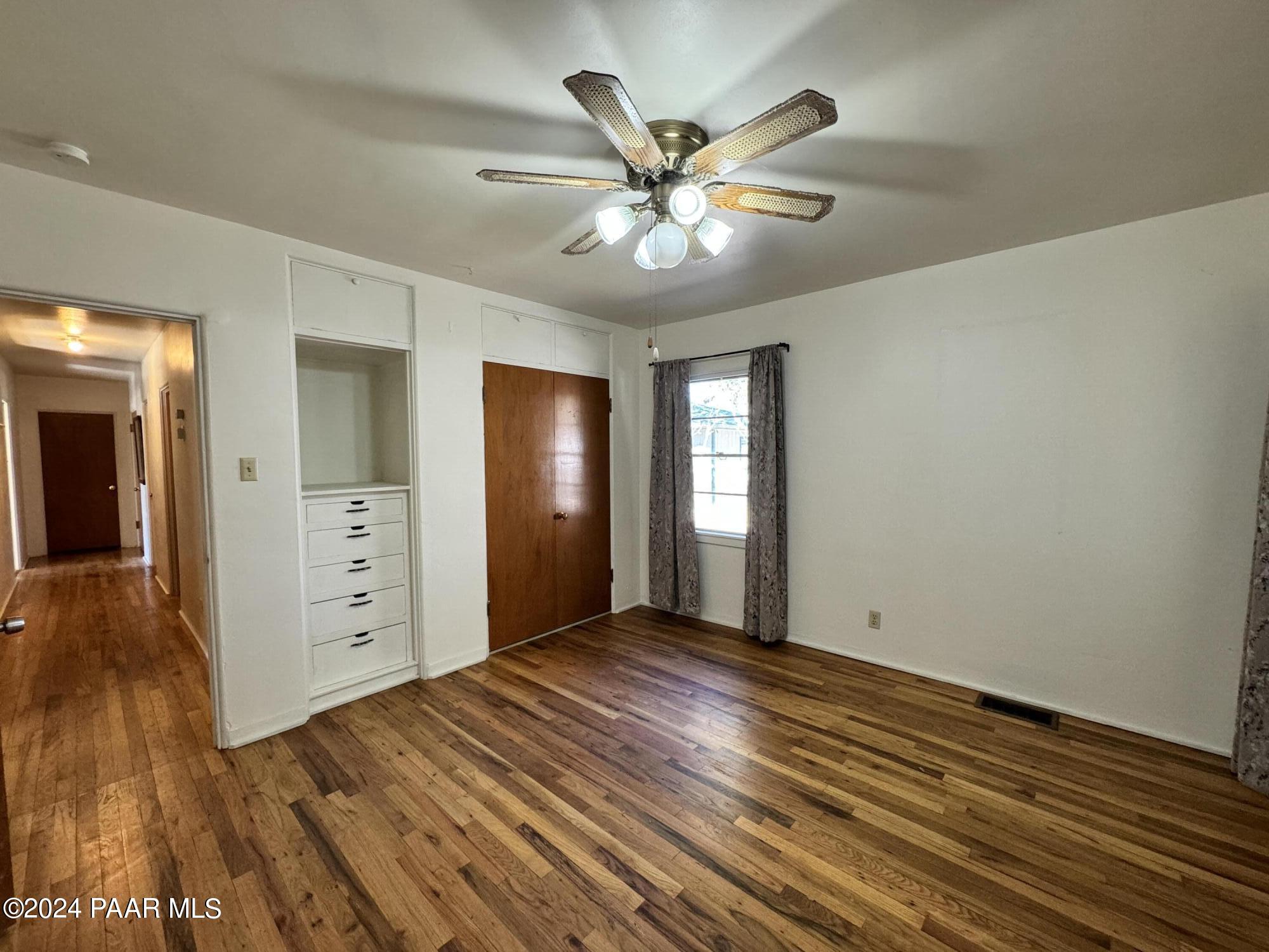 201 Robinson Drive Prescott, AZ 86303 - Photo 14 of 52 wooden floor in an empty room with a window
