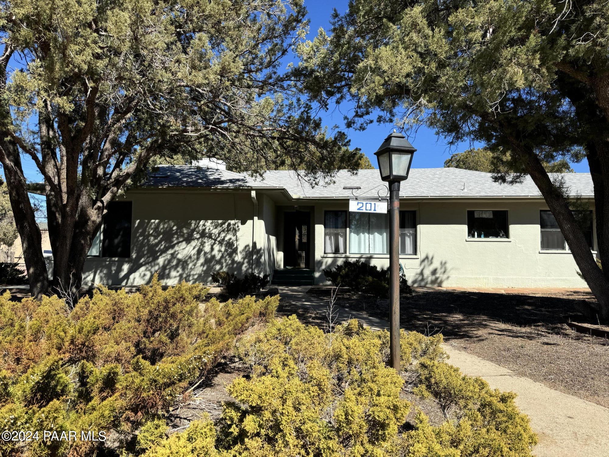 201 Robinson Drive Prescott, AZ 86303 - Photo 2 of 52 a view of a houses with snow on the road