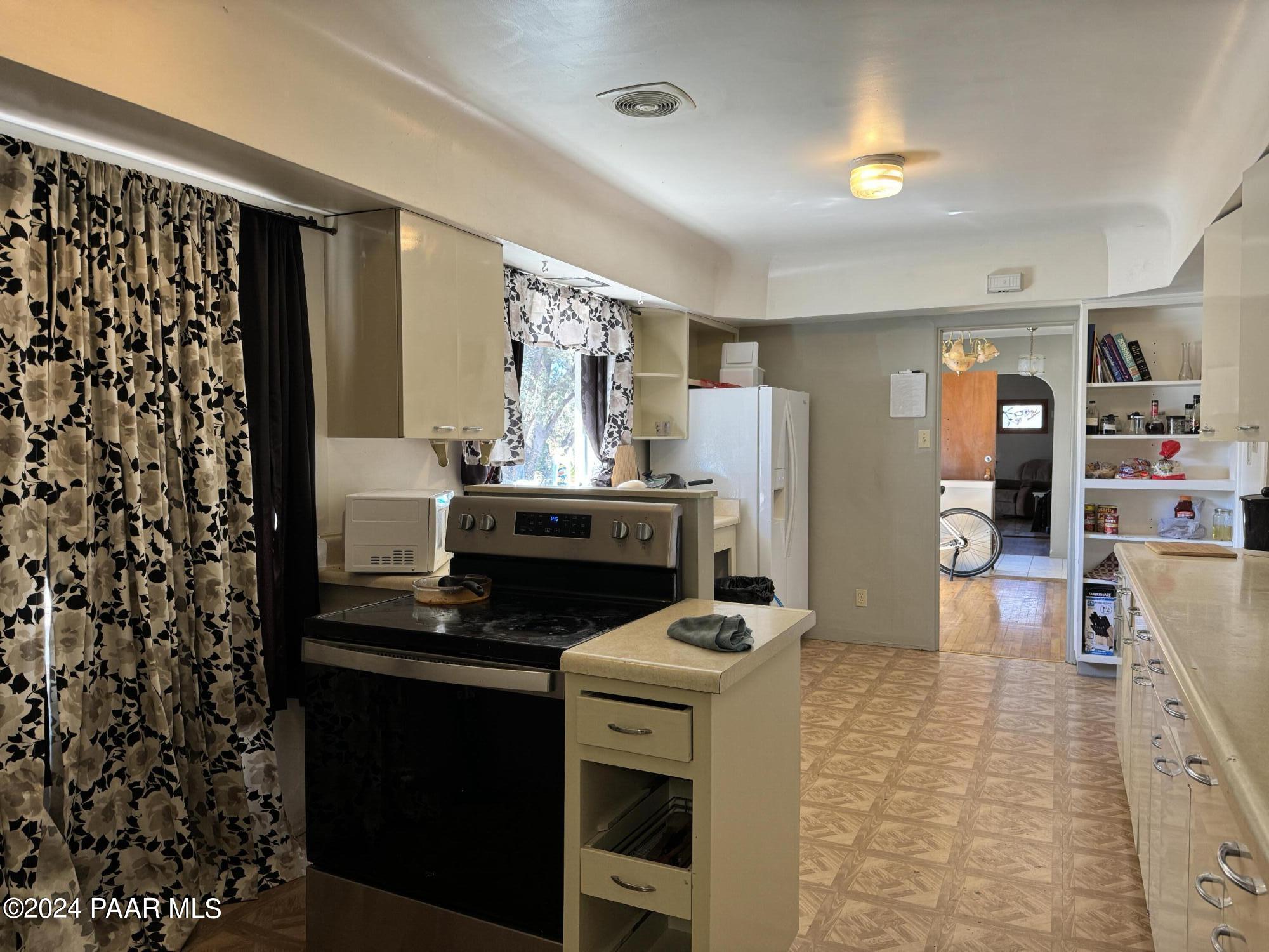 201 Robinson Drive Prescott, AZ 86303 - Photo 23 of 52 a kitchen with a stove and a refrigerator