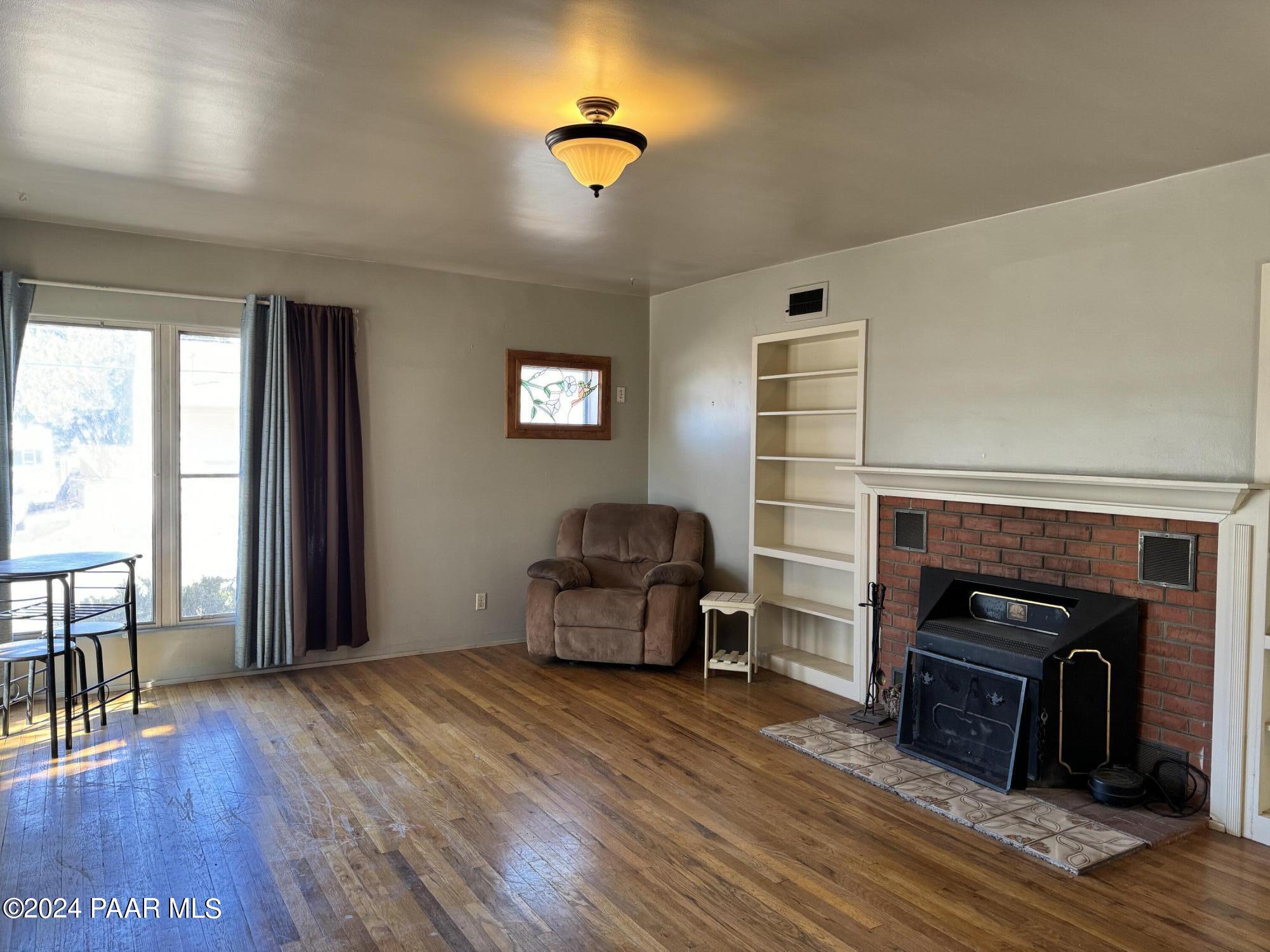 201 Robinson Drive Prescott, AZ 86303 - Photo 26 of 52 a living room with furniture and a fireplace