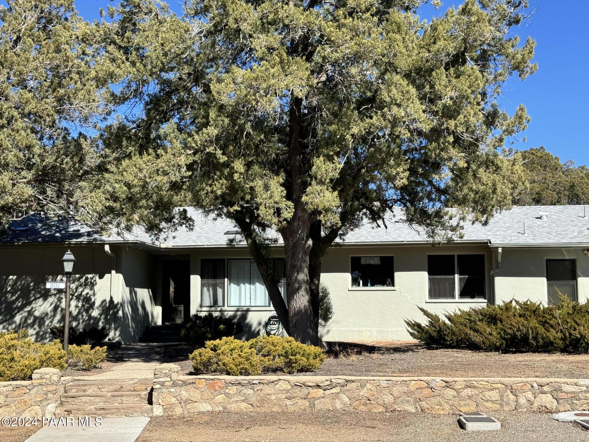 201 Robinson Drive Prescott, AZ 86303 - Photo 3 of 52 a view of a white house with large tree