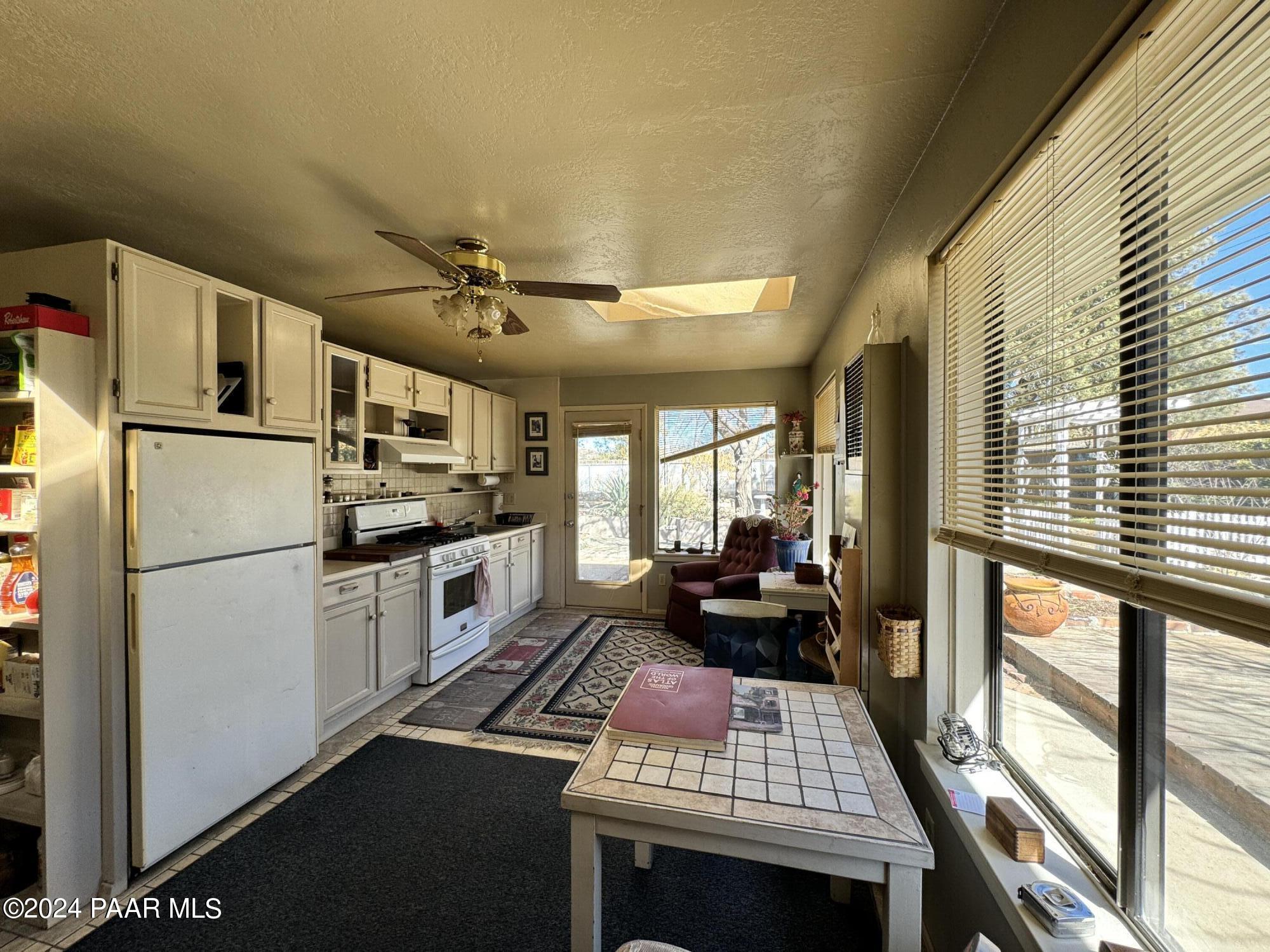 201 Robinson Drive Prescott, AZ 86303 - Photo 33 of 52 a kitchen with a refrigerator a stove a sink and a dishwasher