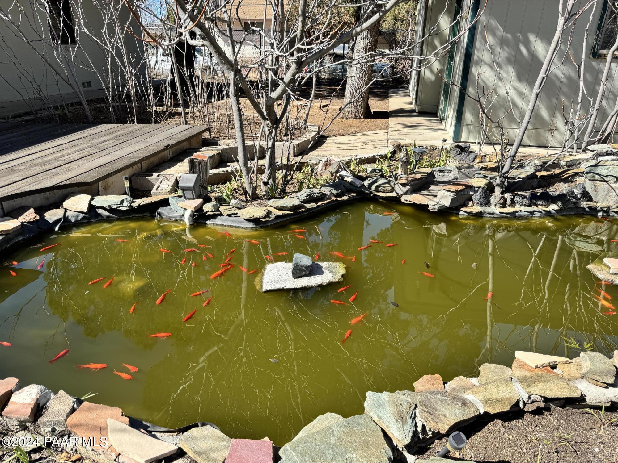 201 Robinson Drive Prescott, AZ 86303 - Photo 41 of 52 a view of a swimming pool with a lawn chairs and couches