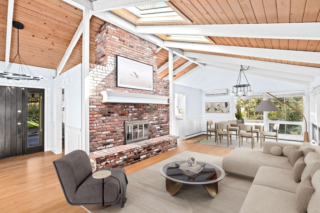 27 Everett Street Norfolk, MA 02056 - Photo 13 of 37 a living room with furniture a rug and a chandelier