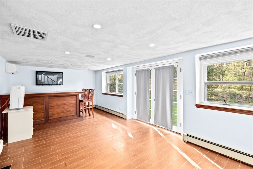 27 Everett Street Norfolk, MA 02056 - Photo 20 of 37 a view of a livingroom with furniture and a window