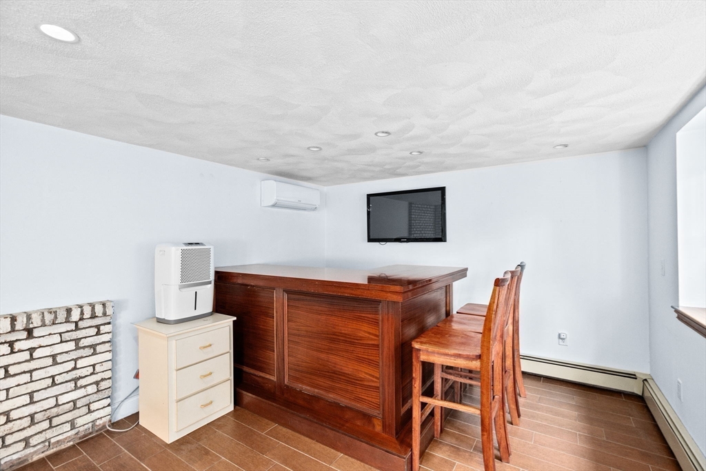 27 Everett Street Norfolk, MA 02056 - Photo 22 of 37 a dining room with furniture and wooden floor