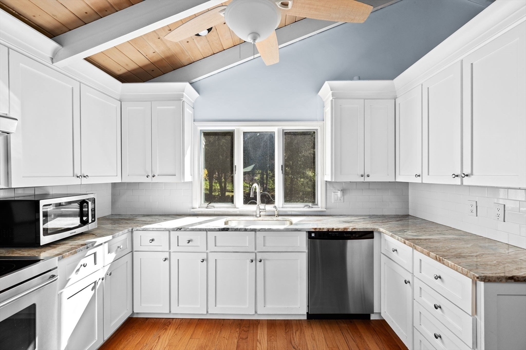 27 Everett Street Norfolk, MA 02056 - Photo 6 of 37 a kitchen with granite countertop white cabinets and white appliances
