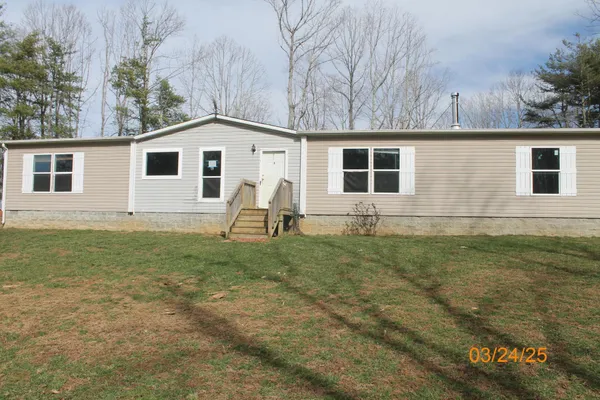 a house with trees in the background