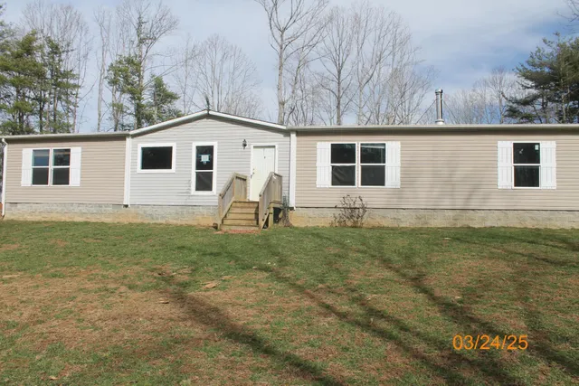 a house with trees in the background
