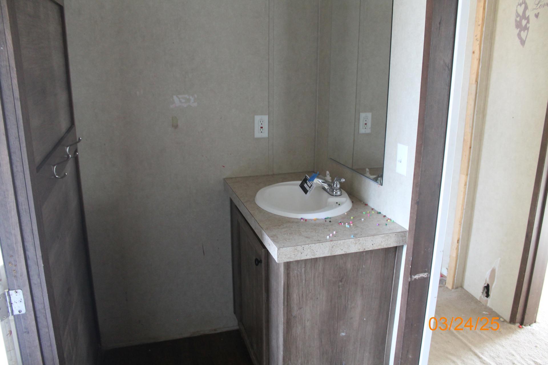 1935 Lick Ridge Road Northeast Check, VA 24072 - Photo 23 of 30 a bathroom with a sink and a mirror