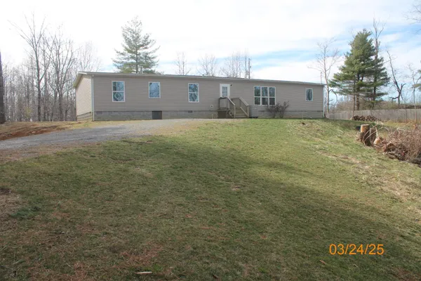 a view of a backyard of the house