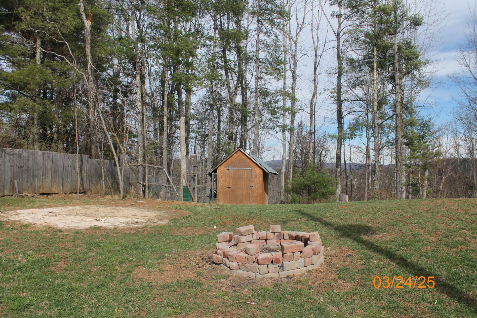 1935 Lick Ridge Road Northeast Check, VA 24072 - Photo 9 of 30 a front view of a house with a garden and trees